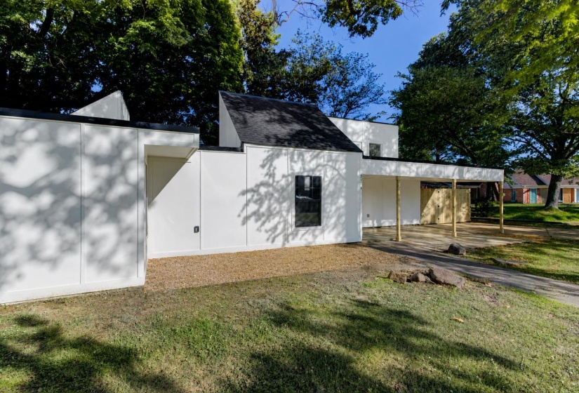 Modern architectural design with a bright white facade and black trim