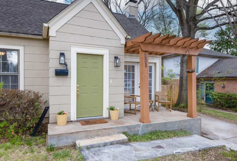 Property entrance with roof with shingles and a chimney