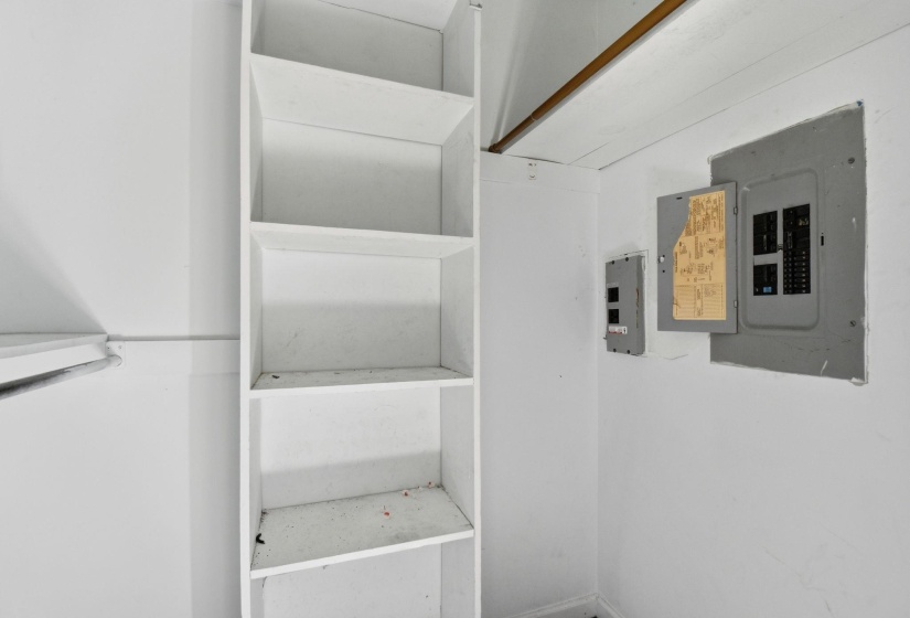 White built-in shelving unit with multiple compartments