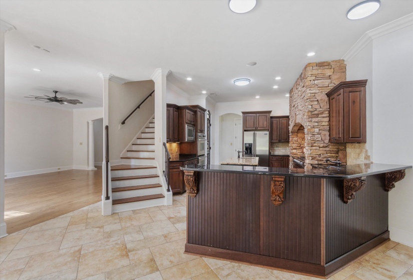 Convenient Rear Stairs just off the Kitchen, providing easy access to Upper Level—ideal for everyday flow and functionality.