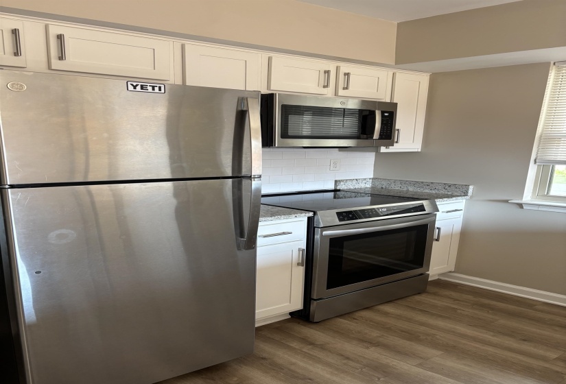 stainless steel fridge, range, microwave and dishwasher plus a washer and dryer...all under 2 years old! And HVAC and Hot Water Heater too!