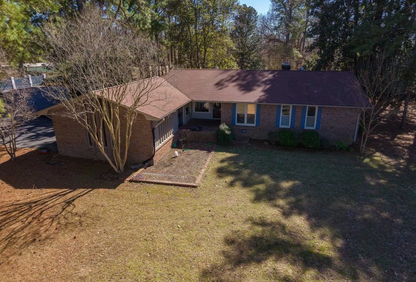 Ranch-style house with a front yard and brick siding. Over 2000 sq ft with 3 bedrooms and 2 baths