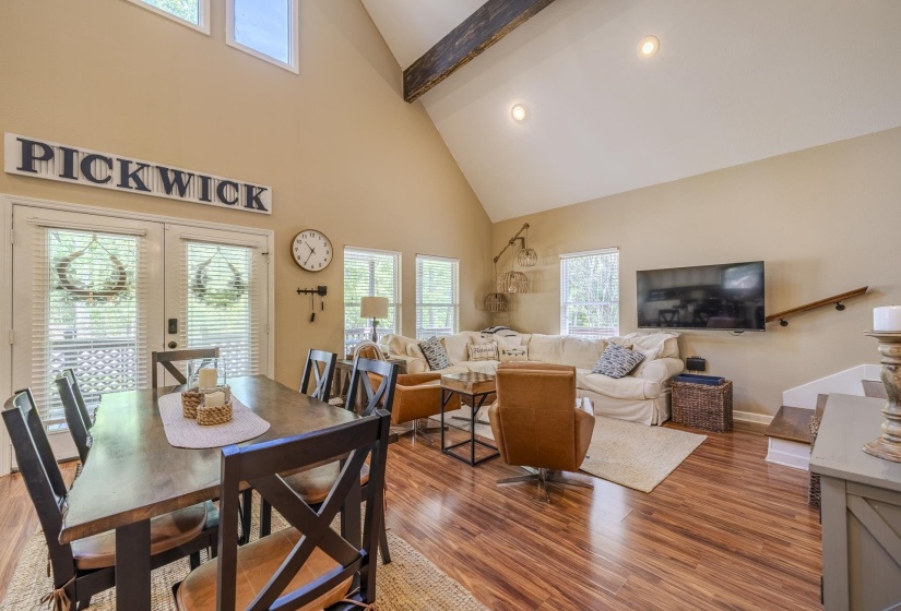 Vaulted ceilings with exposed beam detail and recessed lighting