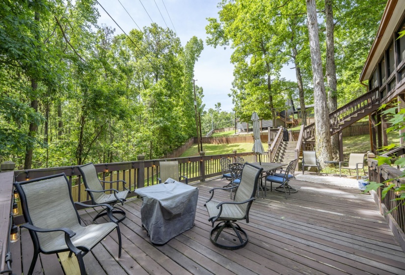 Expansive outdoor deck featuring wood-finish flooring and a full perimeter railing