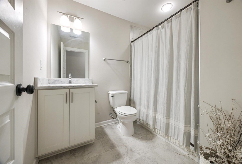 Full bathroom featuring vanity and shower / tub combo