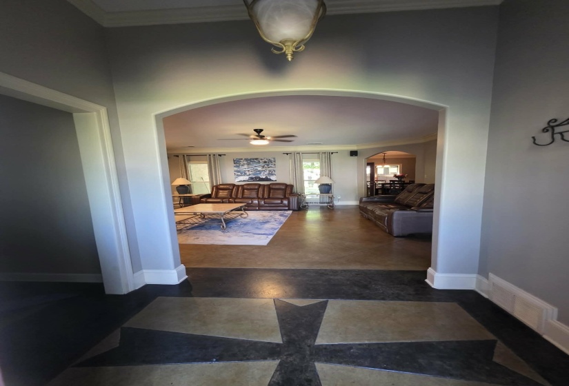 Entryway featuring a decorative ceiling light fixture and an arched opening