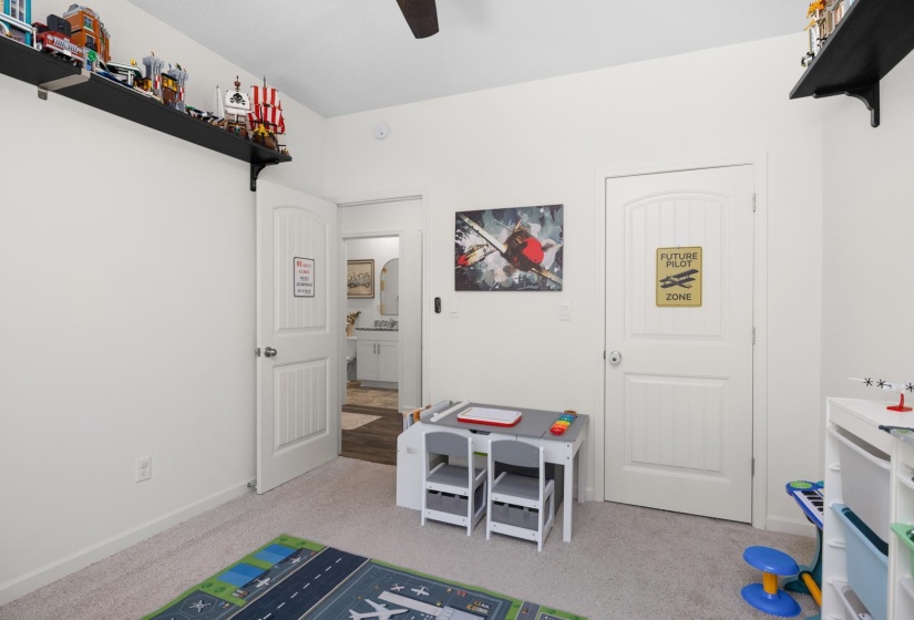 Neutral tone wall paint complements the light-colored carpet flooring