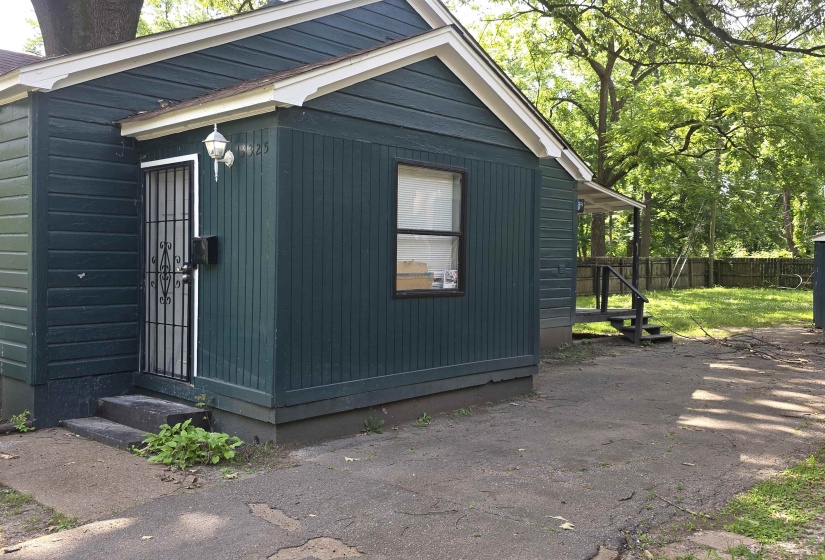 Dark green horizontal siding with white trim