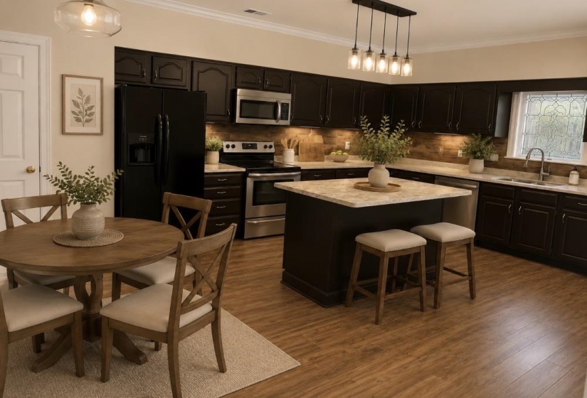 Open-concept kitchen featuring dark cabinetry, stainless steel appliances, and a central island with countertop seating