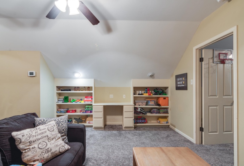 Built-in shelving and desk unit with ample storage