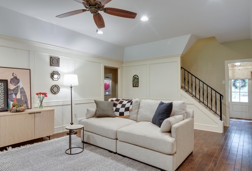 Living area featuring wood-finish flooring, recessed lighting, and a ceiling fan