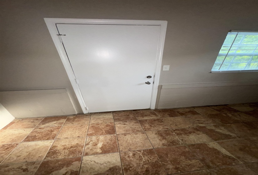 White interior door with a deadbolt and knob hardware