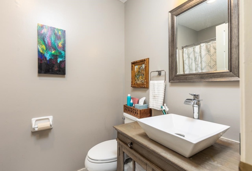 Full bathroom featuring toilet and vanity