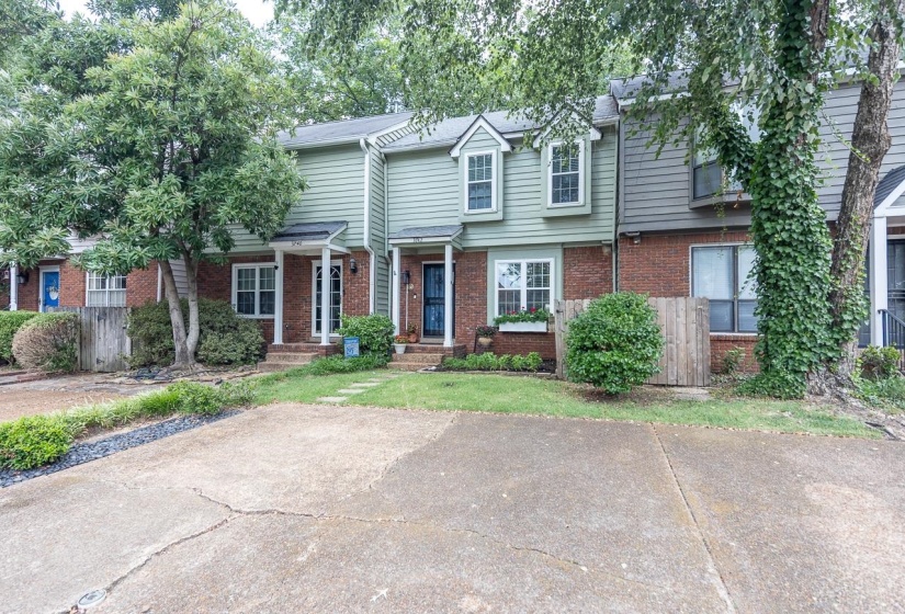 Traditional-style home with brick siding