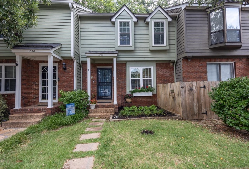 Traditional-style house featuring brick siding