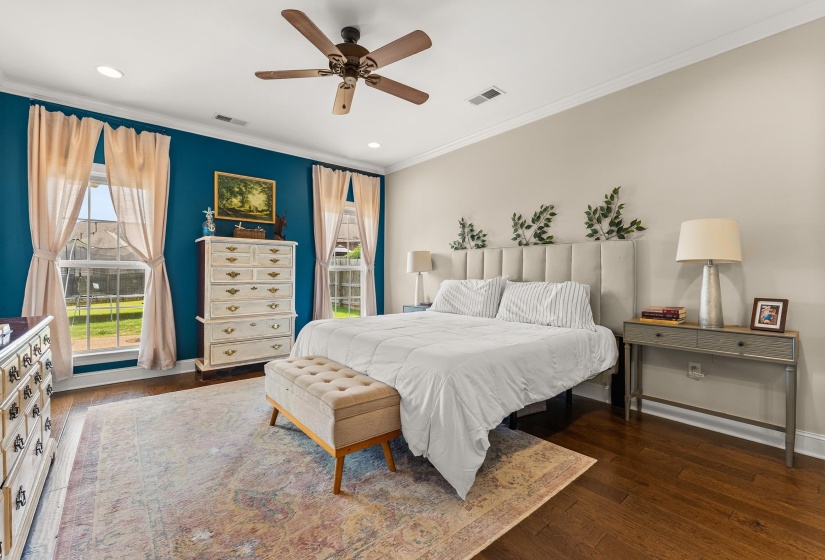 Room featuring wood-finish flooring, a ceiling fan, and recessed lighting