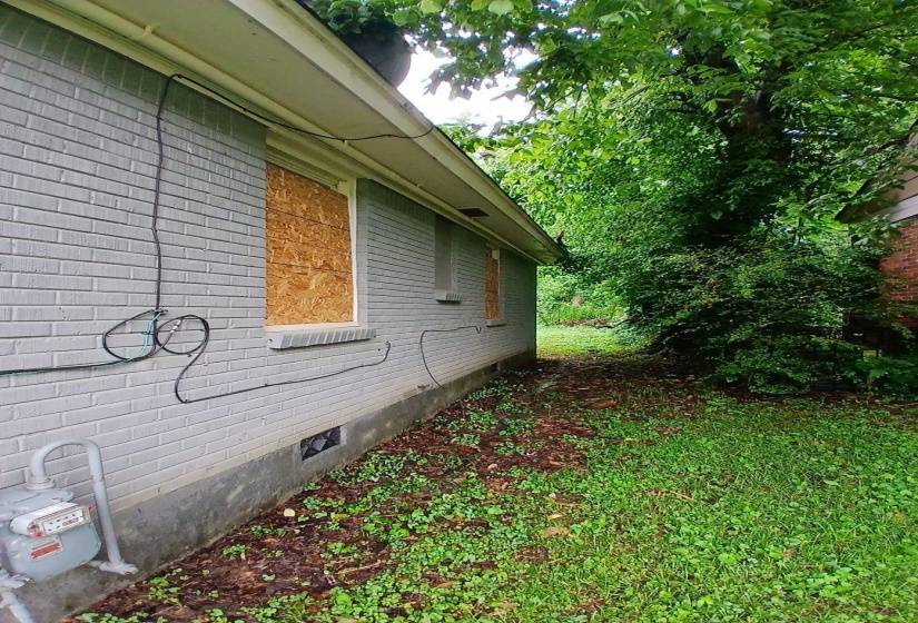 Light gray brick exterior with a dark gray foundation