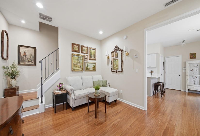 Open concept living area featuring wood-finish flooring