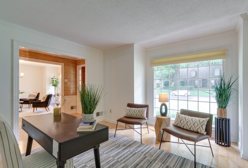Hardwood-finish flooring extending into an open entryway