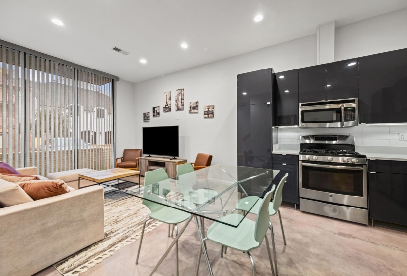 Open-concept living space featuring high ceilings and recessed lighting