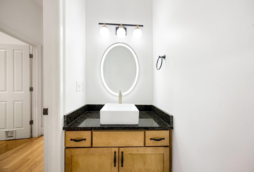 Bathroom with vanity and wood finished floors