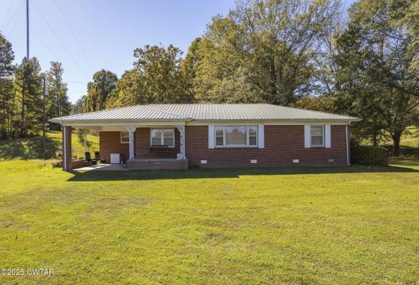 Brick exterior with a light-colored metal roof