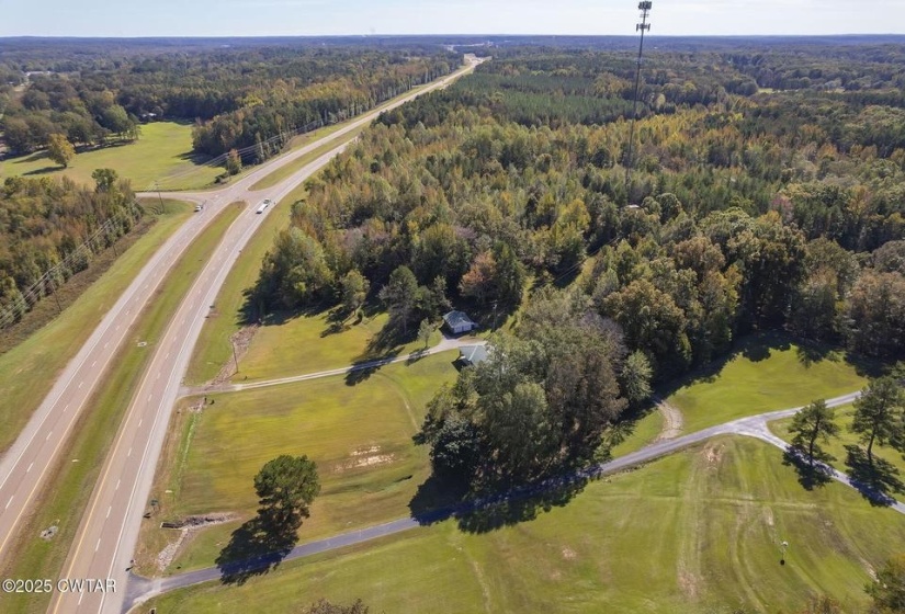 Expansive acreage featuring mature trees and green space