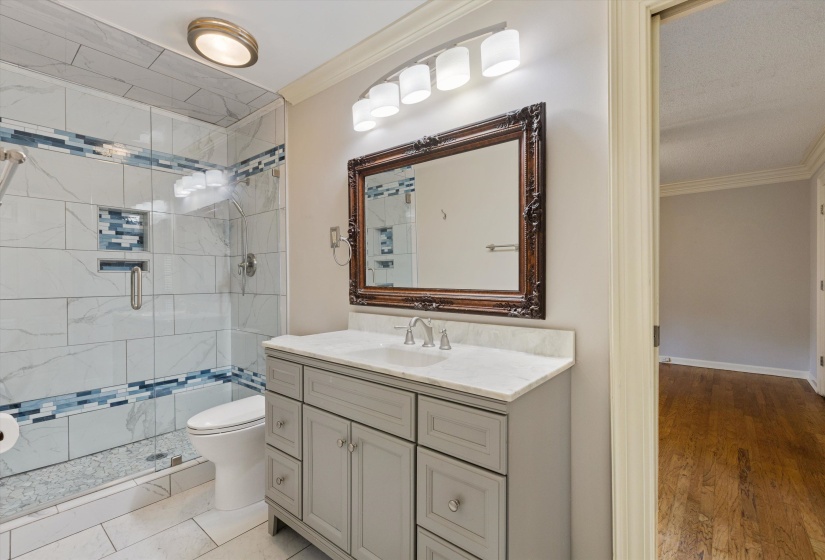 Primary Bath with walk-in shower and spacious walk-in closet.