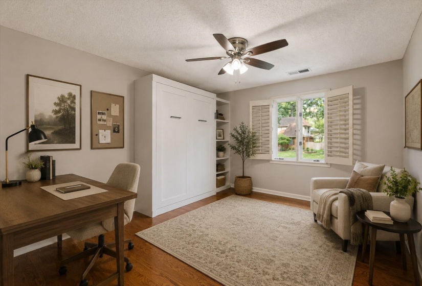 Versatile Bedroom 5 with hardwood flooring, ceiling fan, and built-in Murphy bed ideal for guests or home office flexibility. Virtually Staged Photo