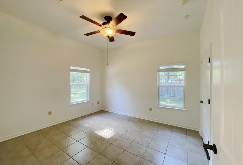 Room featuring vaulted ceilings and tile flooring
