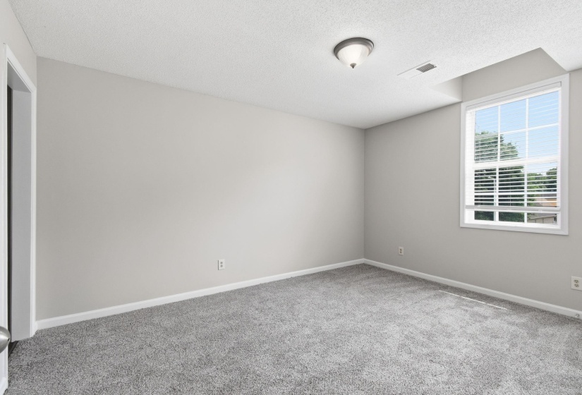 Carpeted interior with light gray wall paint