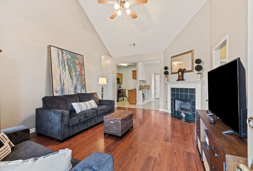 Soaring vaulted ceiling in Greatroom- open concept living! Smooth surface luxury flooring, Gas Fireplace