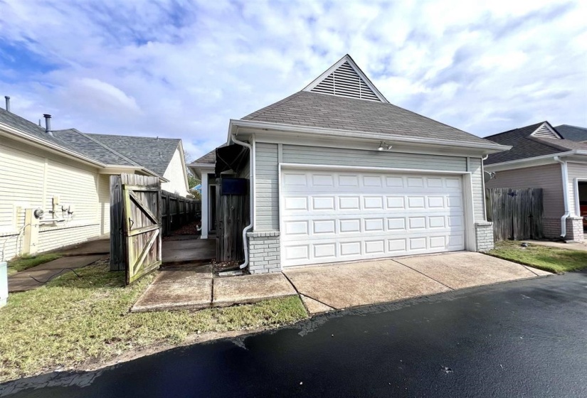 Garage with a gate and a water view