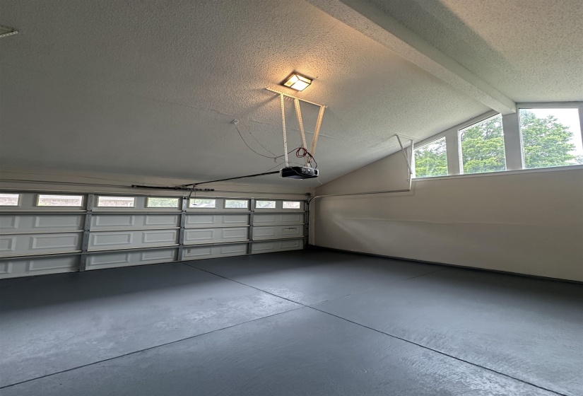 Spacious garage featuring a durable gray floor coating