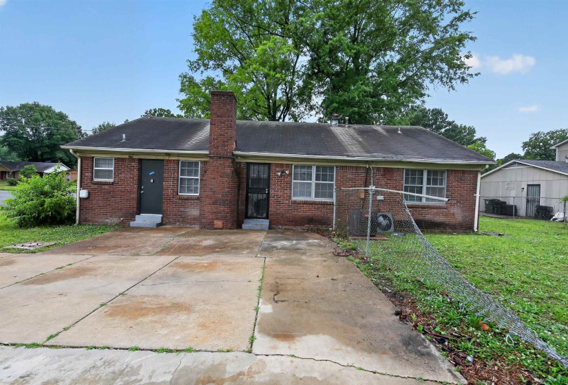 Brick exterior property featuring dual entryways