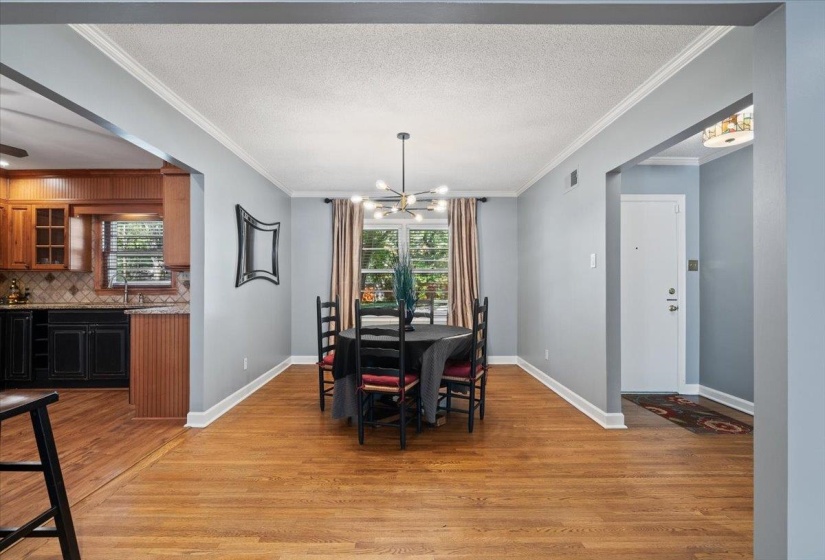 Dining area featuring plenty of natural light with light wood-style flooring
