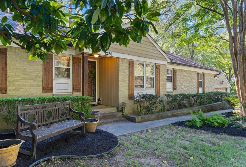 Entrance to property with brick siding
