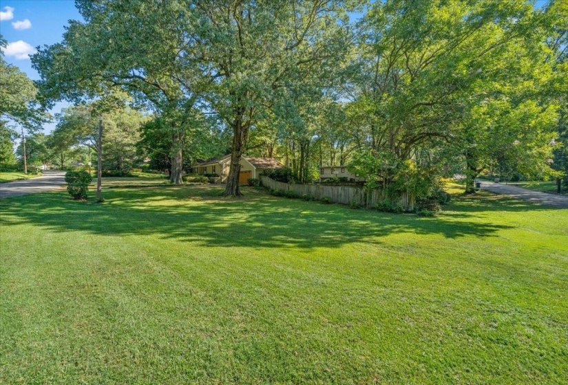 View of yard with view of wooded area