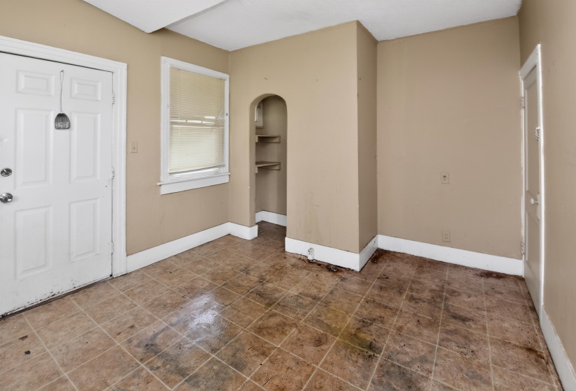 Interior room with neutral wall paint and white baseboards