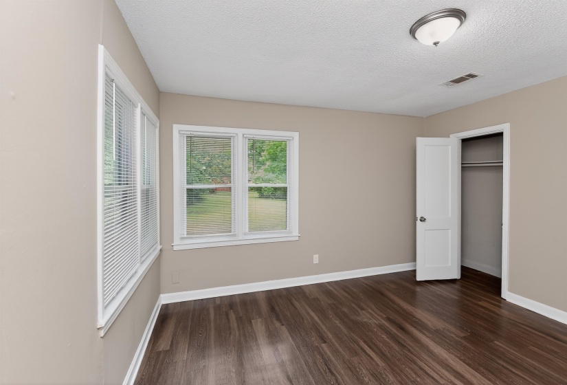 Interior room featuring wood-finish flooring and neutral wall tones