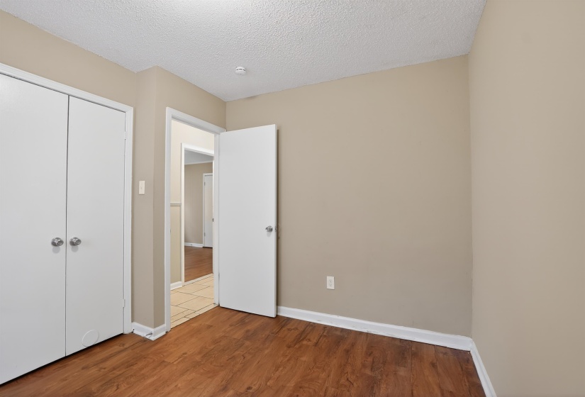Warm neutral wall tones with wood-finish flooring