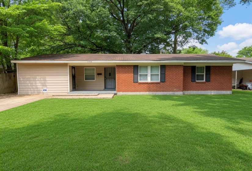 Ranch-style exterior featuring a red brick facade with tan siding accents