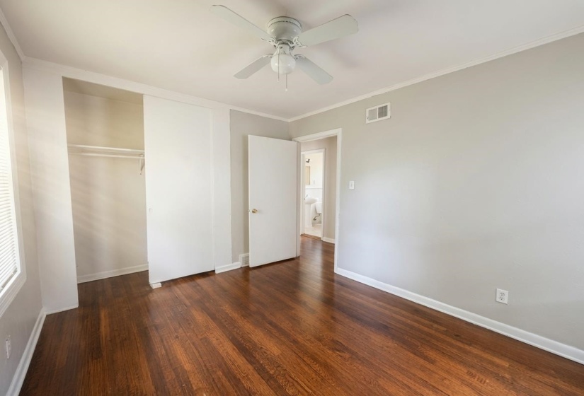 Rich wood-finish flooring complements light-toned walls