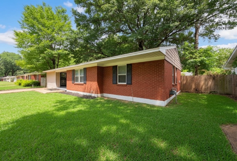 Brick exterior with a gabled roof and white soffit