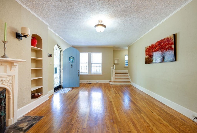 Hardwood flooring extending throughout the room