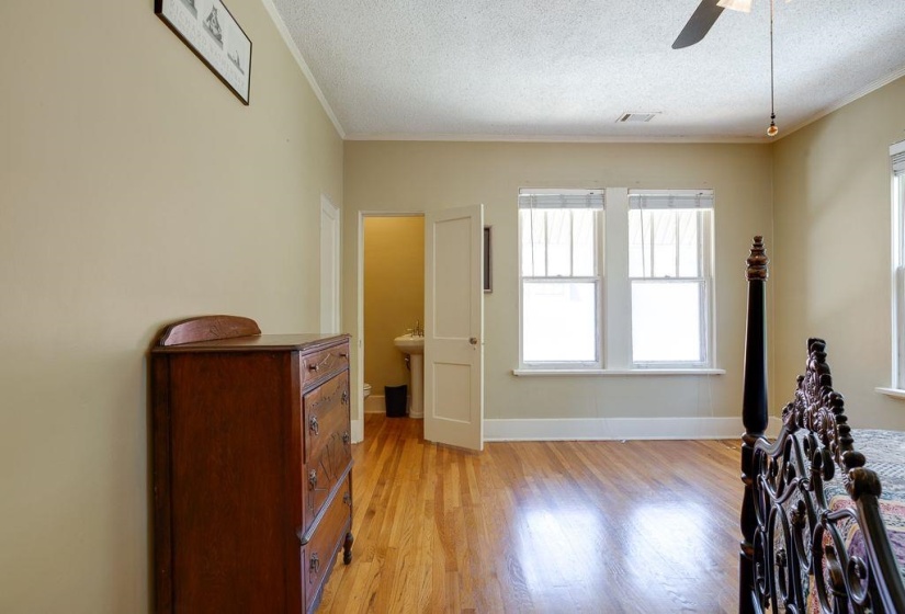 Room featuring wood-finish flooring, light-colored walls, and a white ceiling