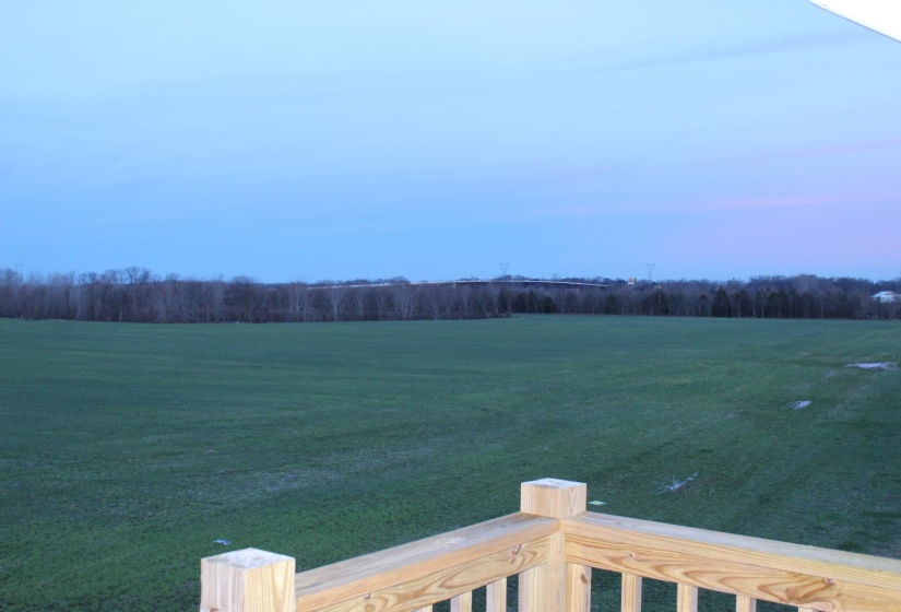 View of green lawn with a view of rural / pastoral area