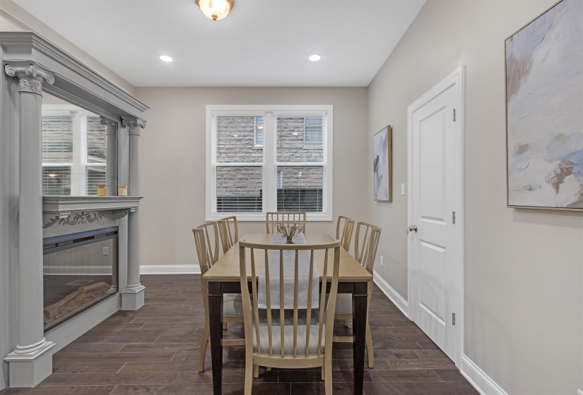 Dining space featuring dark hardwood / wood-style flooring and a wealth of natural light