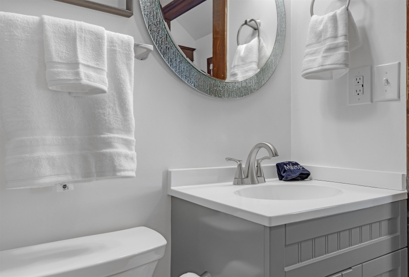 Bathroom featuring vanity and toilet