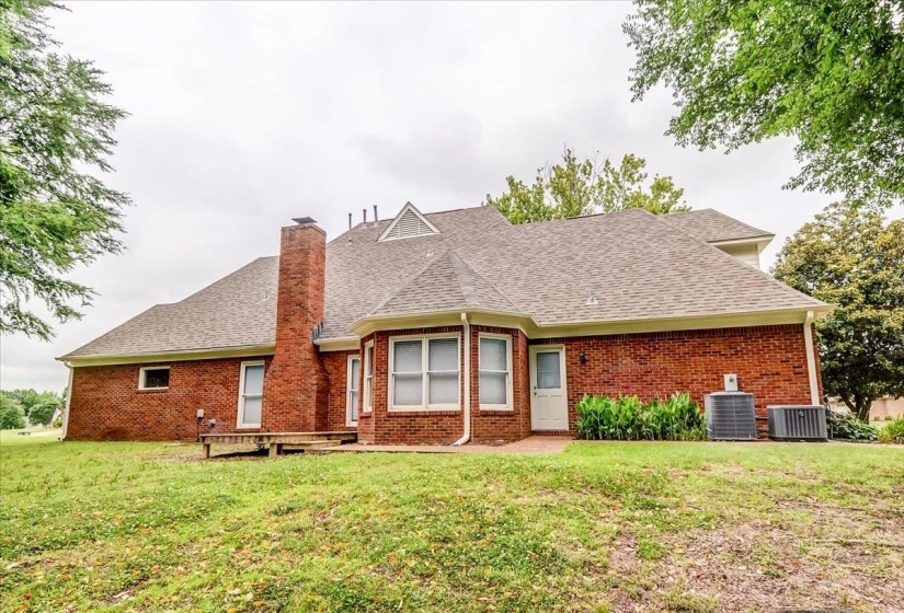 Brick exterior featuring multiple gabled rooflines